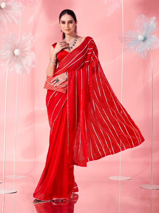 Red colored fancy embellished saree