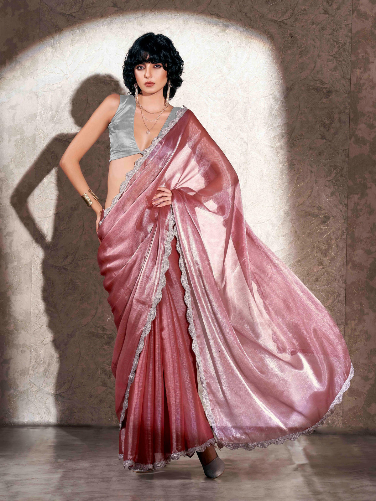 Pink colored shimmer chiffon saree with embellished border