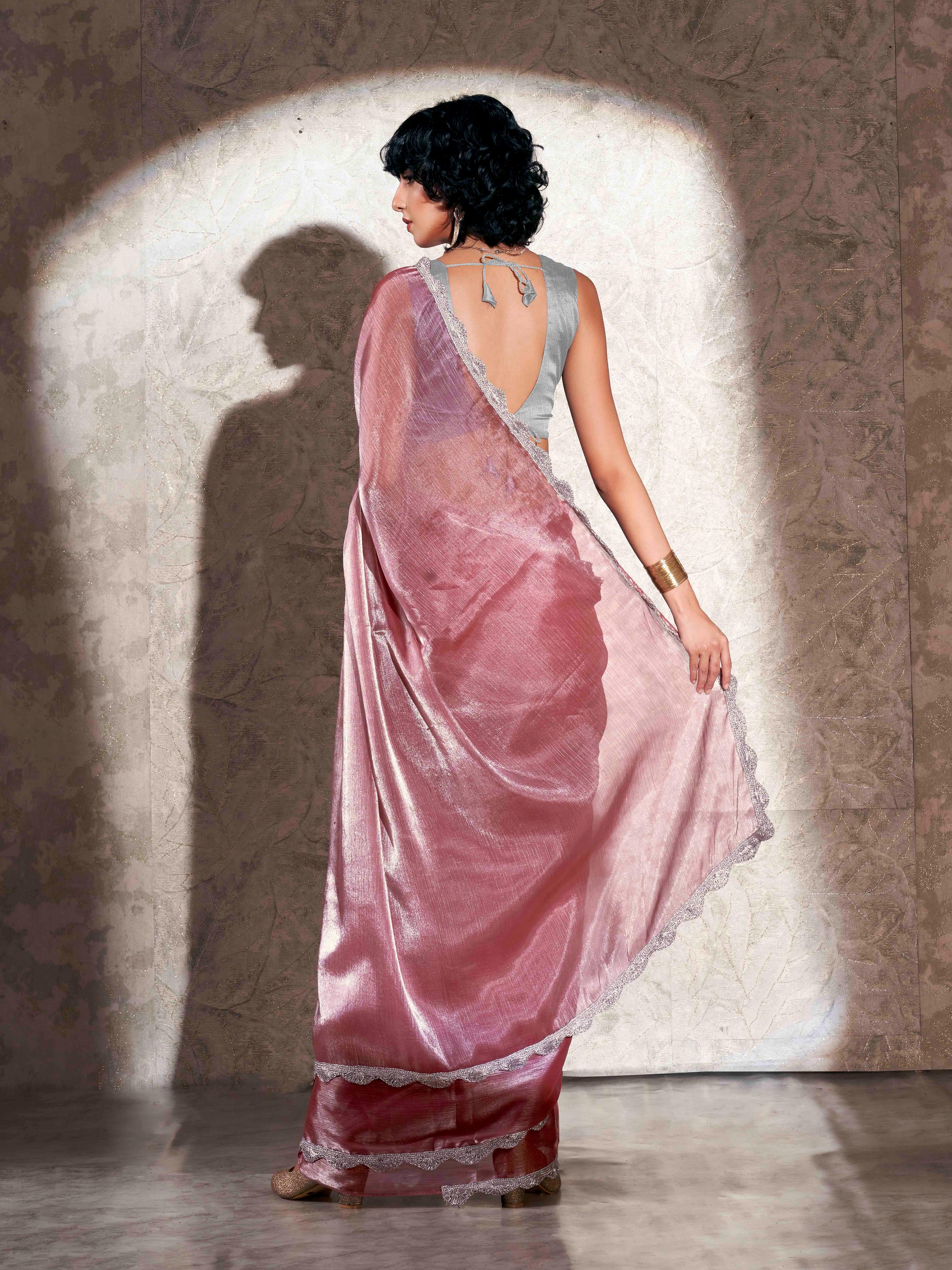 Pink colored shimmer chiffon saree with embellished border