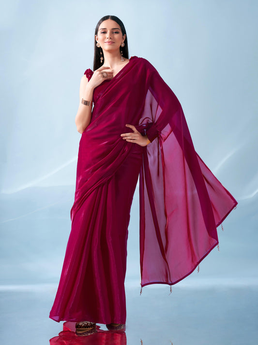 Pink colored shimmer organza designer saree with velvet blouse and stretchable cuffs on pallu