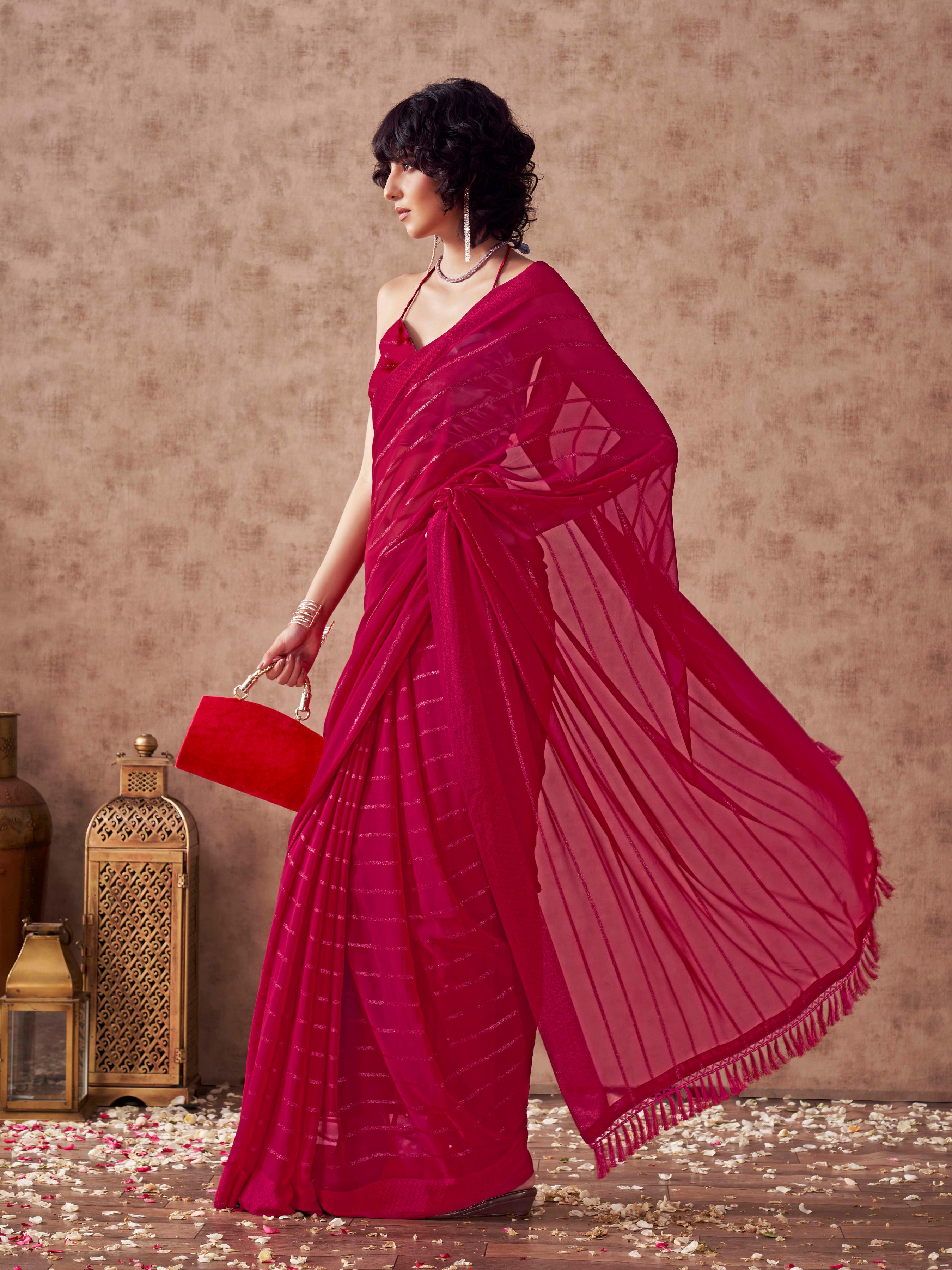 Maroon colored striped saree with embroidered blouse