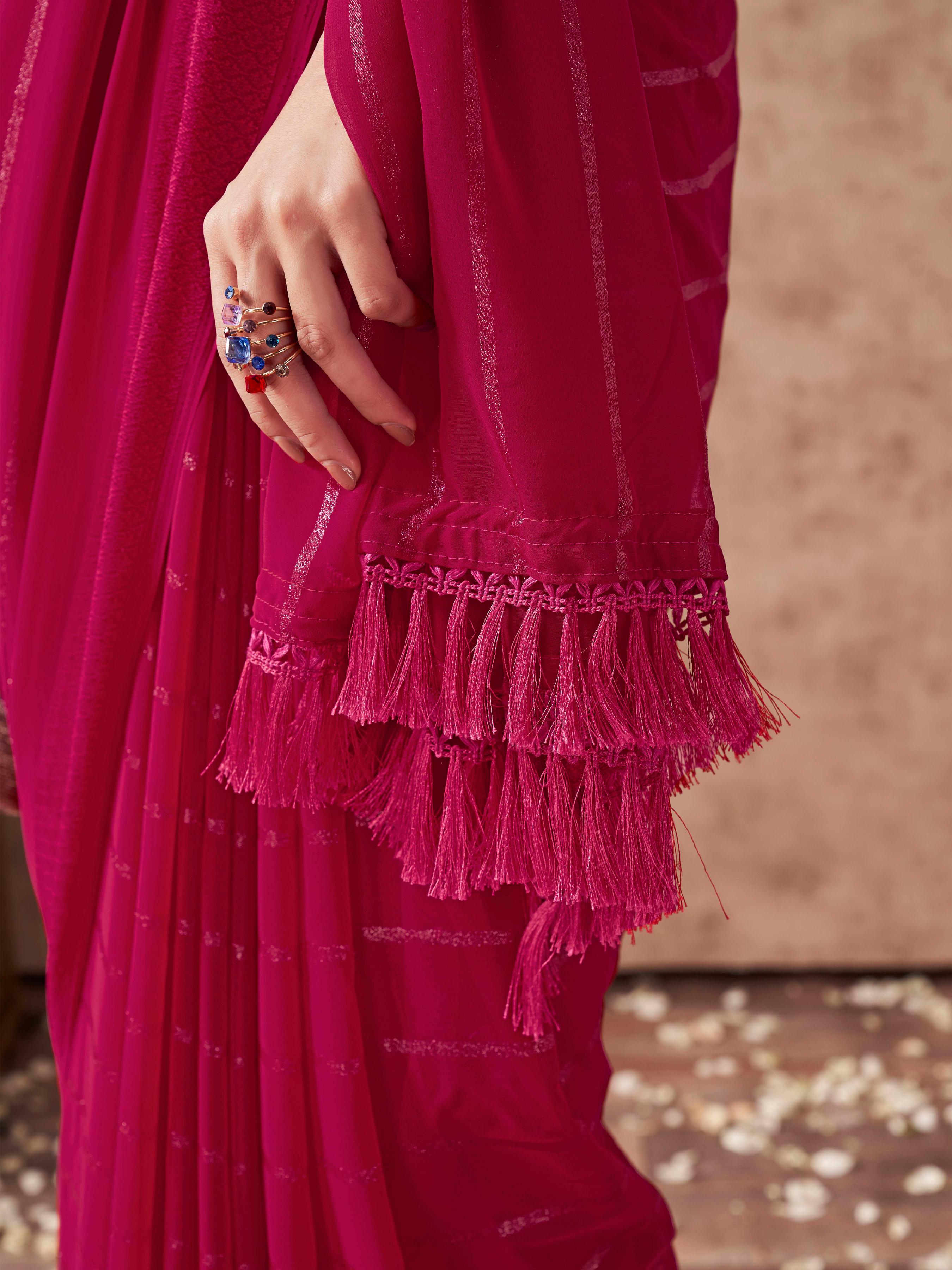 Maroon colored striped saree with embroidered blouse