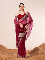 Maroon colored net embroidered saree