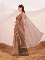 Copper colored organza saree with fur blouse and embellished border