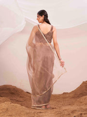 Copper colored organza saree with fur blouse and embellished border