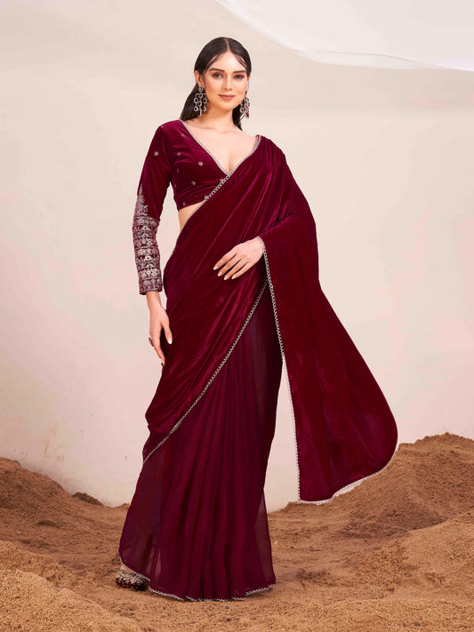 Maroon colored velvet half and half saree with heavy embroidered full sleeves blouse