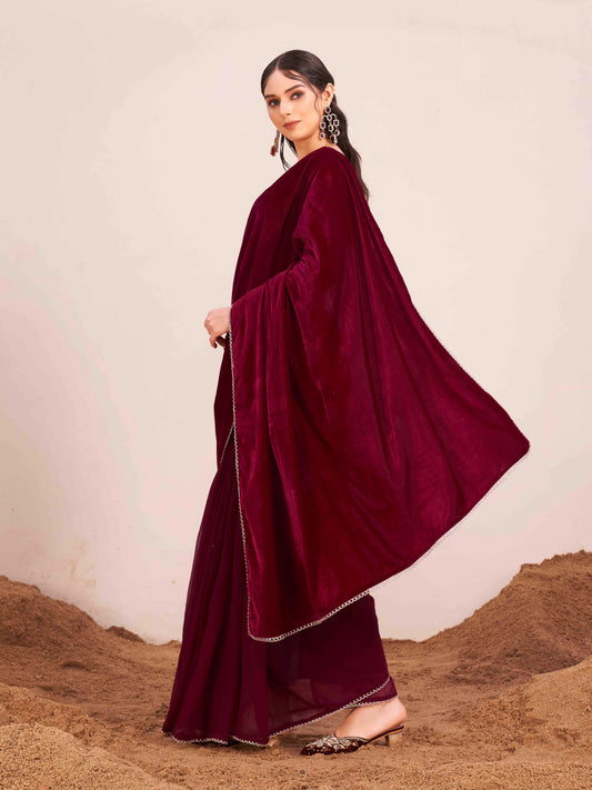 Maroon colored velvet half and half saree with heavy embroidered full sleeves blouse