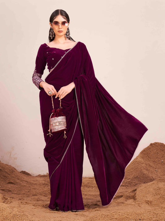 Magenta colored velvet half and half saree with heavy embroidered full sleeves blouse