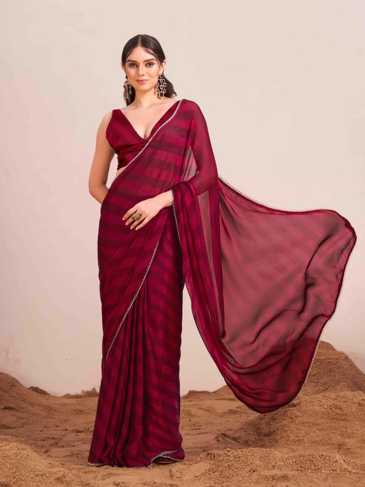 Maroon colored lehariya woven saree with embellished border