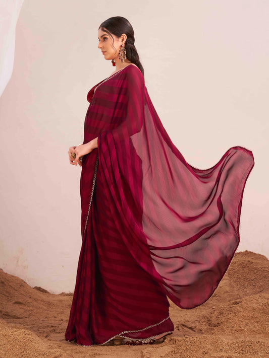 Maroon colored lehariya woven saree with embellished border