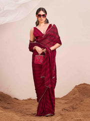 Maroon colored lehariya woven saree with embellished border