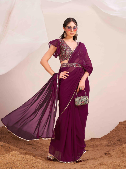 Magenta colored poly georgette saree with embroidered blouse and belt