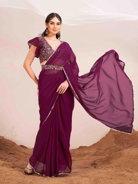 Magenta colored poly georgette saree with embroidered blouse and belt