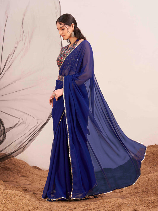 Blue colored poly georgette saree with embroidered blouse and belt