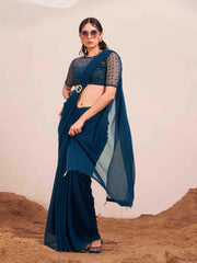 Blue colored designer poly georgette saree with embroidered blouse and a metallic ring on waist to accentuate the pallu