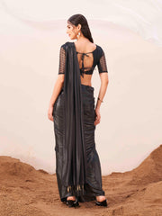 Metallic Charcoal black colored designer satin saree with embroidered blouse and metallic ring on waist to accentuate the pallu