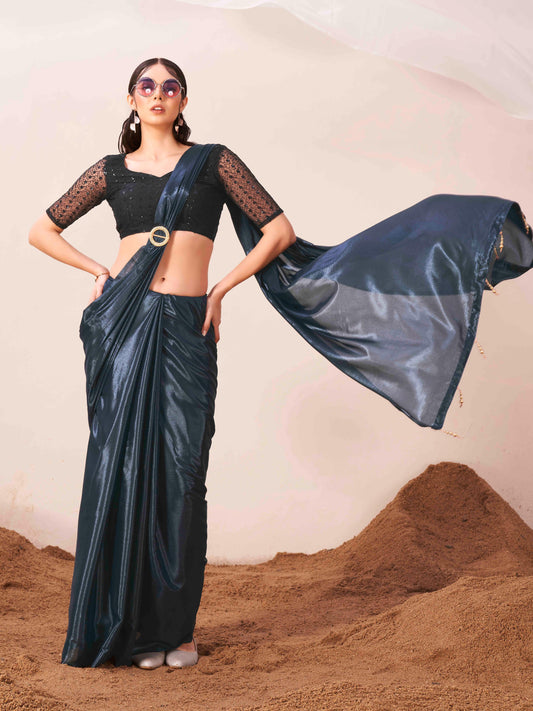 Metallic Teal colored designer satin saree with embroidered blouse and metallic ring on waist to accentuate the pallu