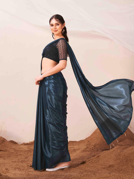 Metallic Teal colored designer satin saree with embroidered blouse and metallic ring on waist to accentuate the pallu