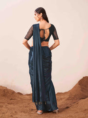 Metallic Teal colored designer satin saree with embroidered blouse and metallic ring on waist to accentuate the pallu