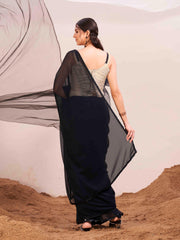 Black colored poly georgette saree with embroidered blouse and belt