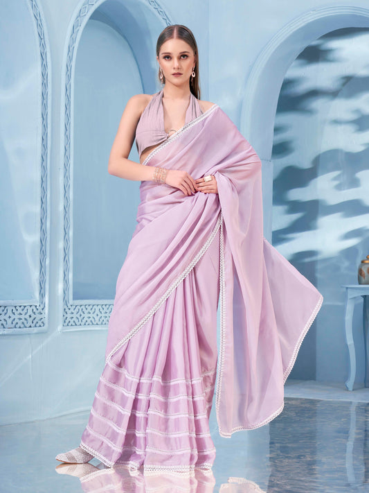 Pink colored rangoli saree with embellished frill lace