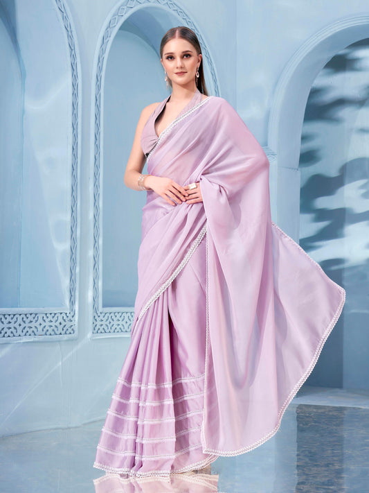 Pink colored rangoli saree with embellished frill lace