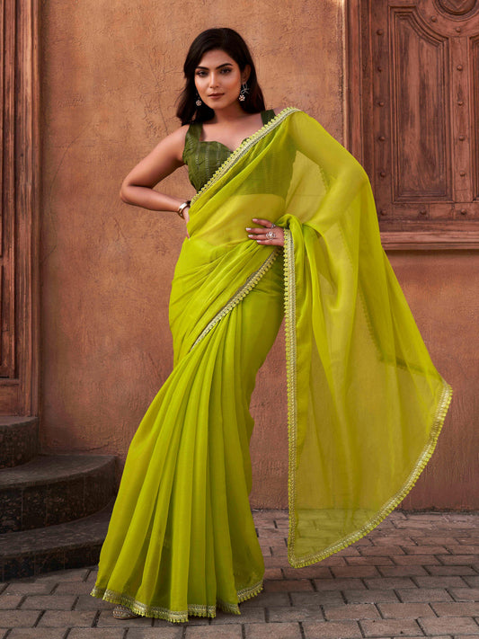 Green colored shimmer chiffon saree with embellished lace and brocade blouse