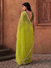 Green colored shimmer chiffon saree with embellished lace and brocade blouse