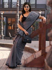 Grey colored shimmer chffon saree with cutwork border