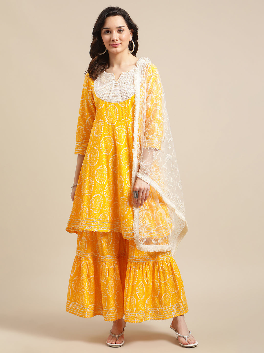 Mustard And White Bandhej Printed Flared Kurta Sharara Set With Net Embroidered Dupatta.