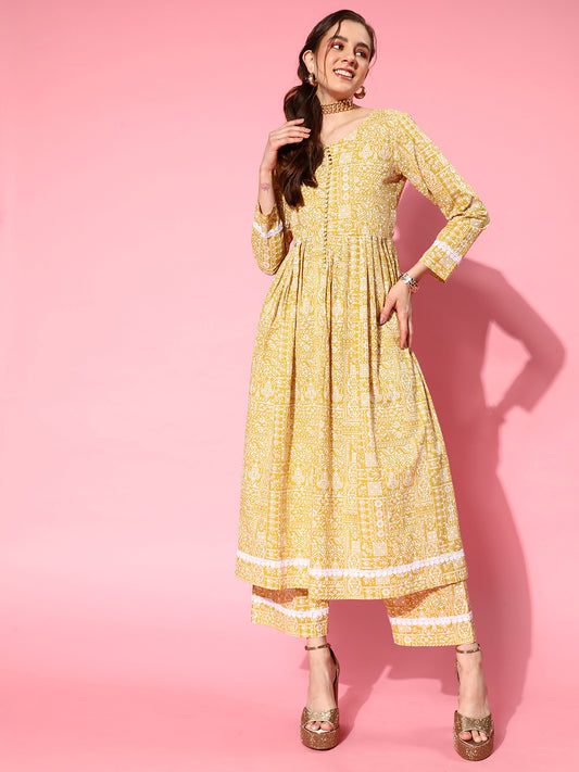 Women Mustard Printeda-Line Kurta With Front Slit,  Embellished With Fabric Potli Button In Placket, Paired With Tonal Printed Bottom