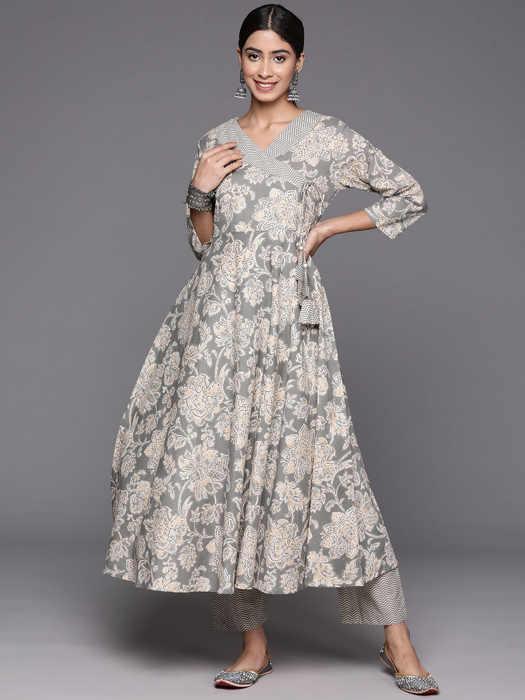 Kalini Women Grey Floral Printed Angrakha Style Anarkali Kurta Paired With Printed Bottom.