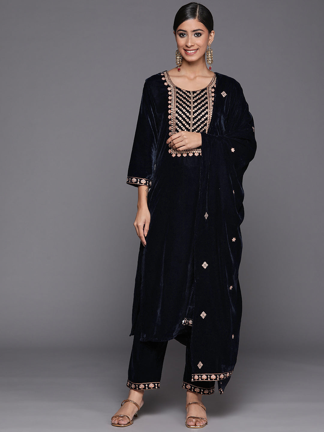 navy blue velvet embroidered kurta paired with embroidered trouser and dupatta